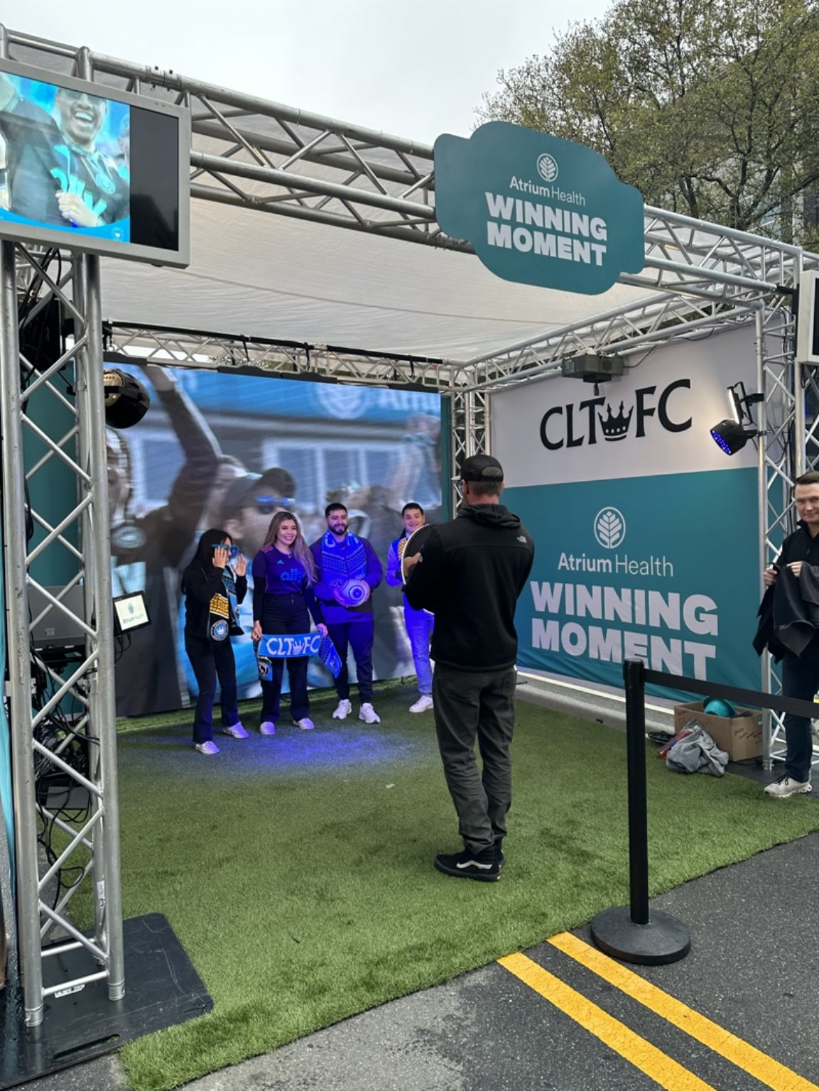 Guests creating a photo and video experience at the Atrium Health Winning Moment activation for Charlotte FC